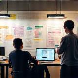 Developers at agile board