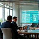 IT consultants meeting and discussing tech strategy